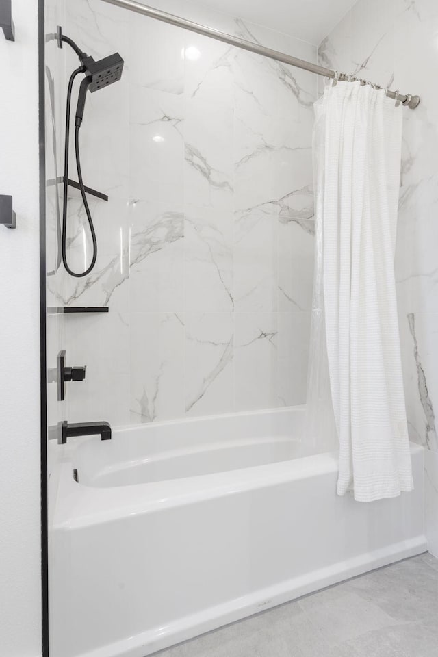 bathroom featuring shower / bathtub combination with curtain