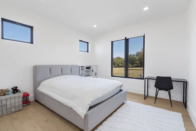 bedroom with light hardwood / wood-style floors