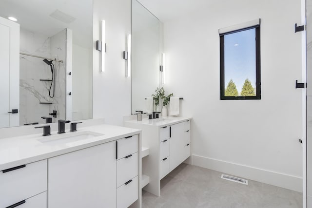 bathroom featuring vanity and walk in shower