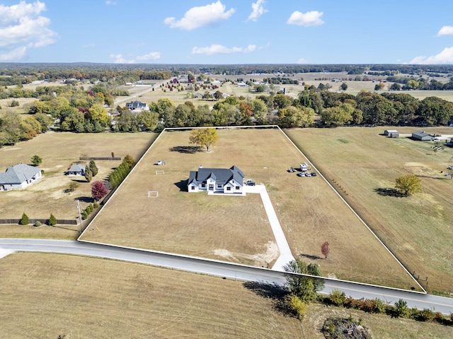 birds eye view of property with a rural view