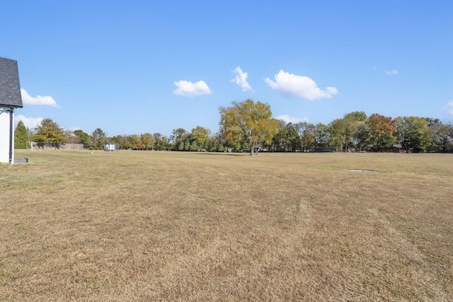 view of yard with a rural view