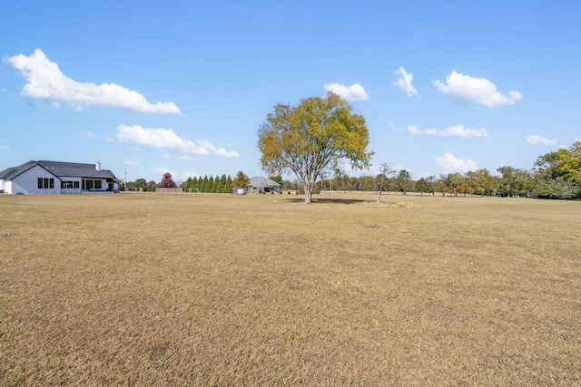 view of yard with a rural view