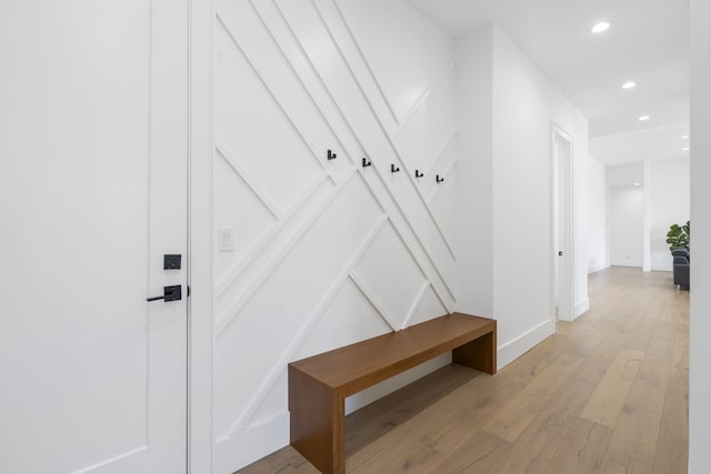 mudroom with light hardwood / wood-style flooring