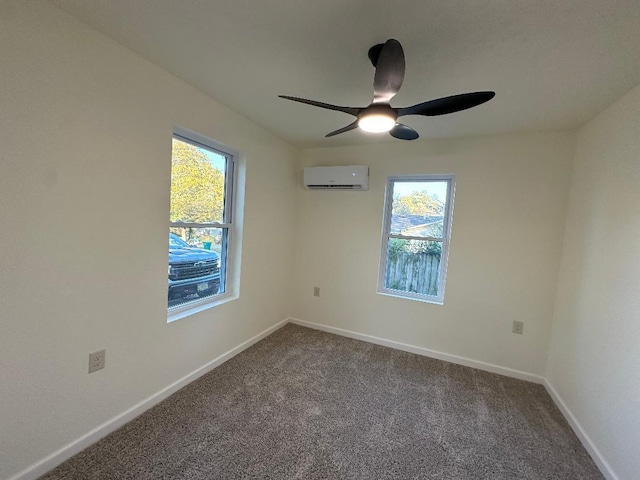 spare room featuring an AC wall unit, carpet, and ceiling fan