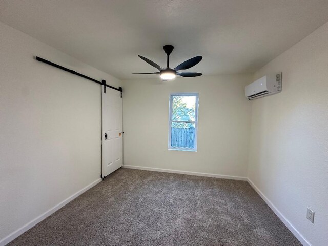 320 W N St, Mountain Grove, MO 65711 - unfurnished bedroom with an AC wall unit, a barn door, carpet, and baseboards