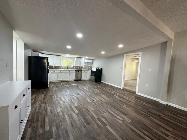 320 W N St, Mountain Grove, MO 65711 - kitchen with freestanding refrigerator, stainless steel dishwasher, electric range, dark wood finished floors, and white cabinets
