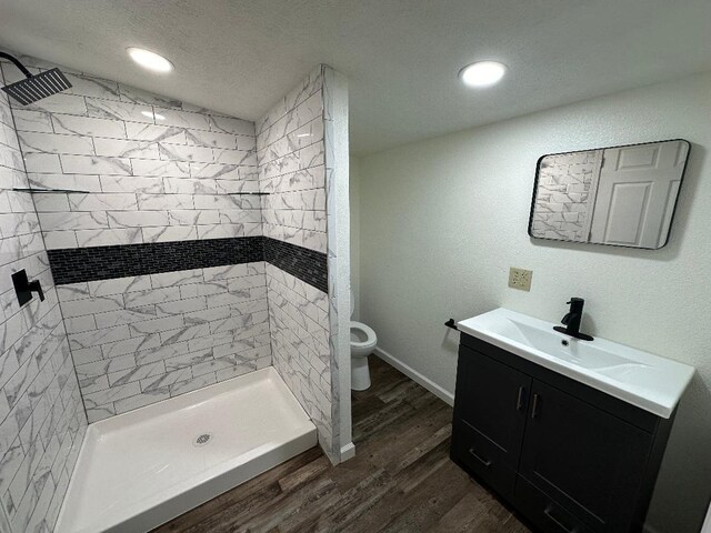 320 W N St, Mountain Grove, MO 65711 - full bath featuring wood finished floors, a stall shower, vanity, toilet, and recessed lighting