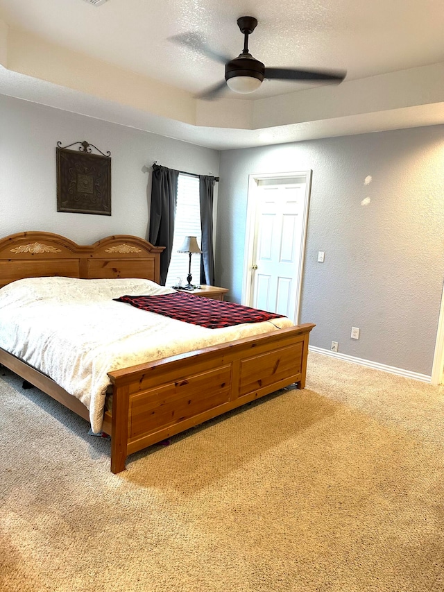 bedroom featuring light carpet and ceiling fan