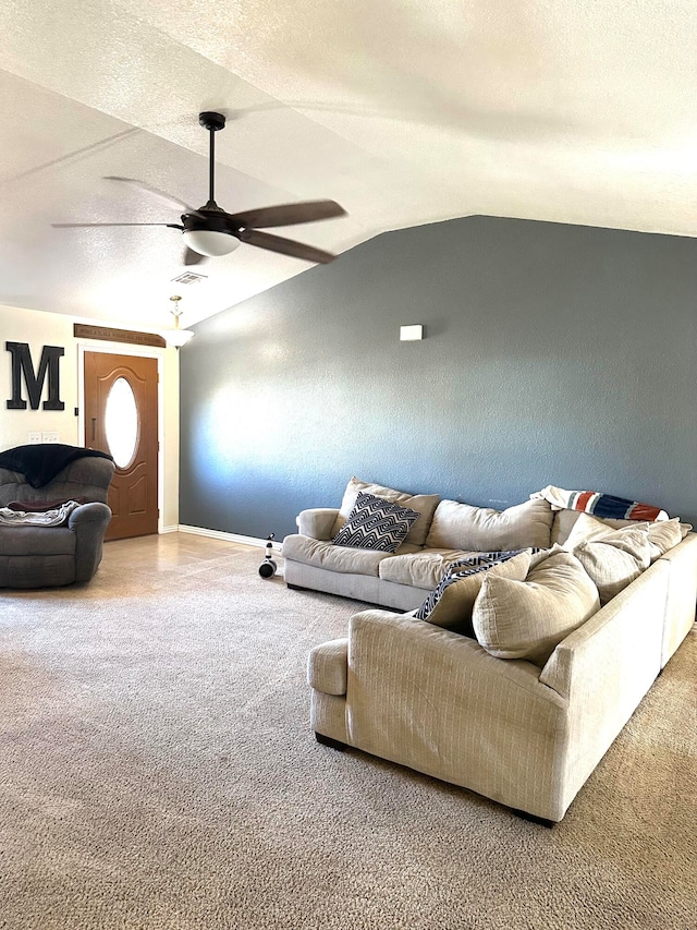 living room featuring carpet flooring, a textured ceiling, vaulted ceiling, and ceiling fan