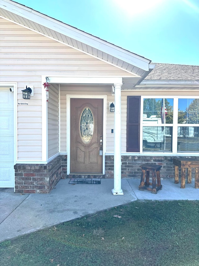 entrance to property with covered porch