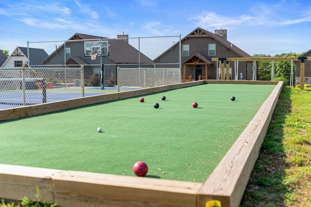 view of community featuring fence and community basketball court