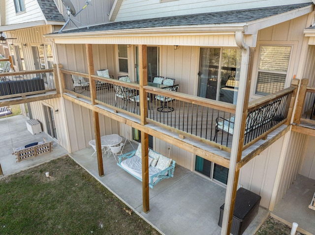 wooden terrace with a patio