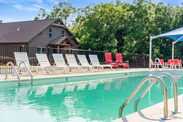 view of swimming pool with a patio