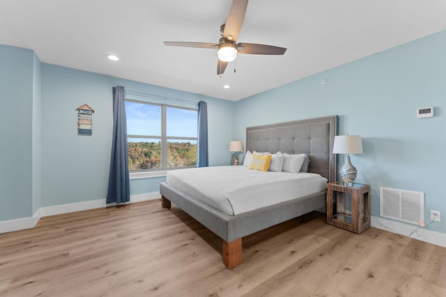 bedroom with visible vents, light wood-style floors, baseboards, recessed lighting, and a ceiling fan