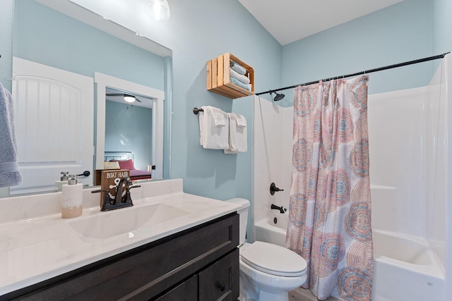ensuite bathroom featuring shower / bath combo with shower curtain, toilet, vanity, and ensuite bathroom