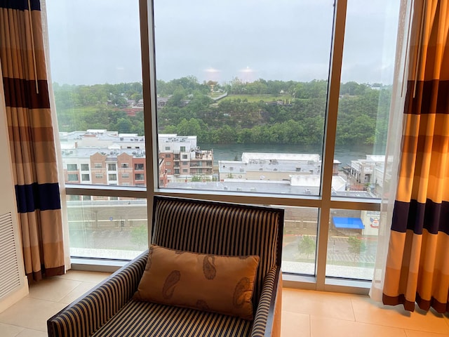 interior space with a baseboard radiator and a water view