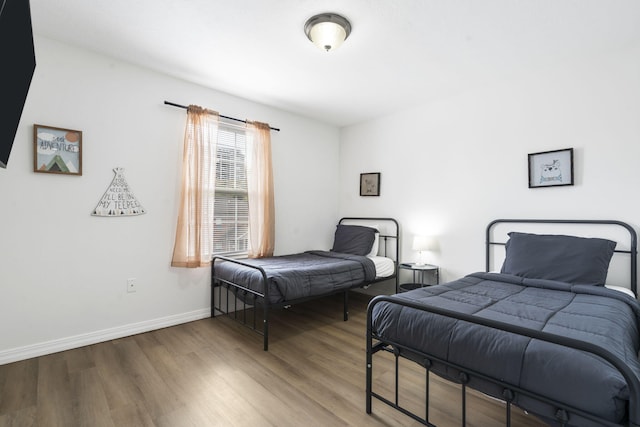 bedroom featuring wood-type flooring