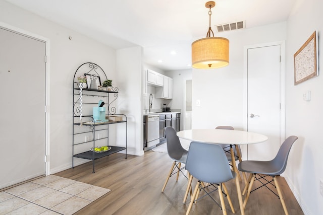 dining room with light hardwood / wood-style floors