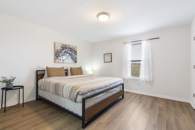 bedroom featuring hardwood / wood-style flooring