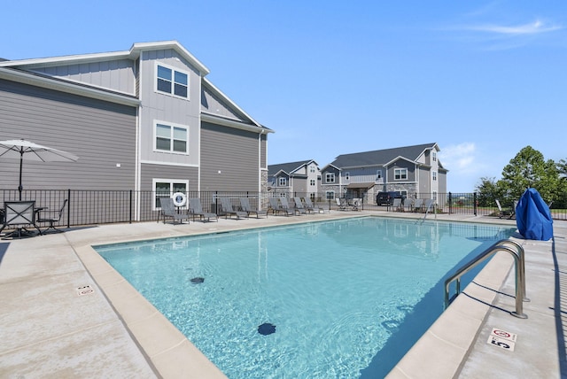 view of swimming pool featuring a patio area