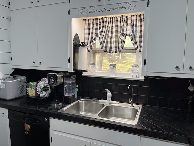 kitchen featuring white cabinetry, decorative backsplash, dishwasher, and sink