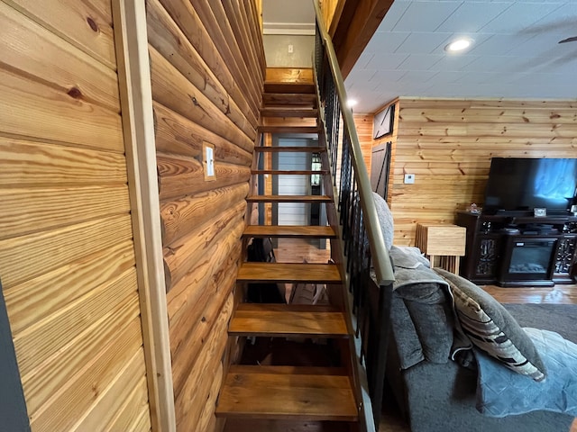 stairs with wood walls