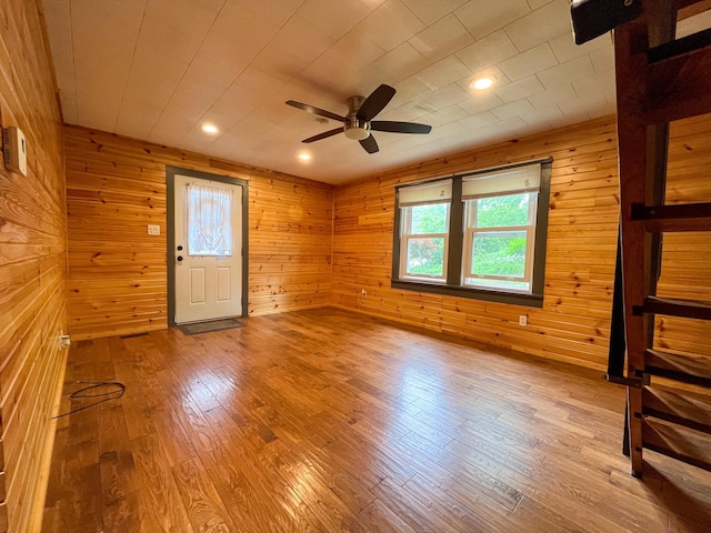 1025 Woodland Ave, West Plains, MO 65775 - spare room featuring ceiling fan, wood finished floors, wooden walls, and recessed lighting