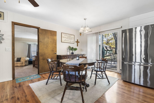 dining area featuring a chandelier and hardwood / wood-style floors