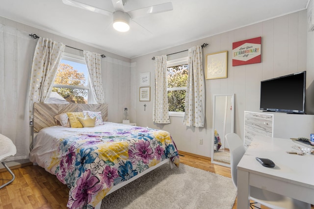 bedroom featuring hardwood / wood-style flooring and ceiling fan