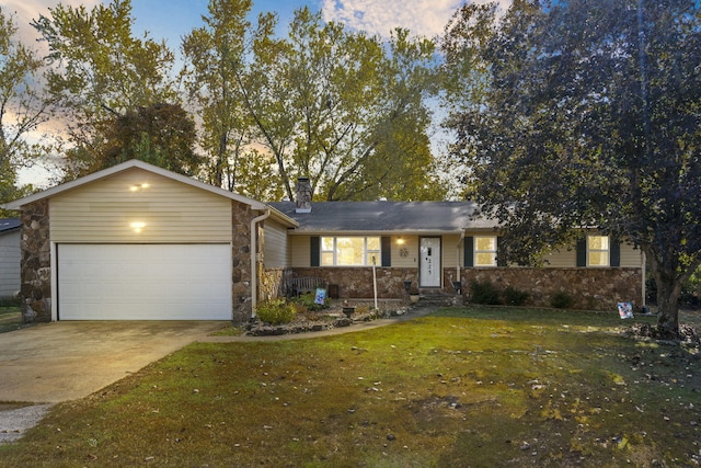 ranch-style house with a yard and a garage