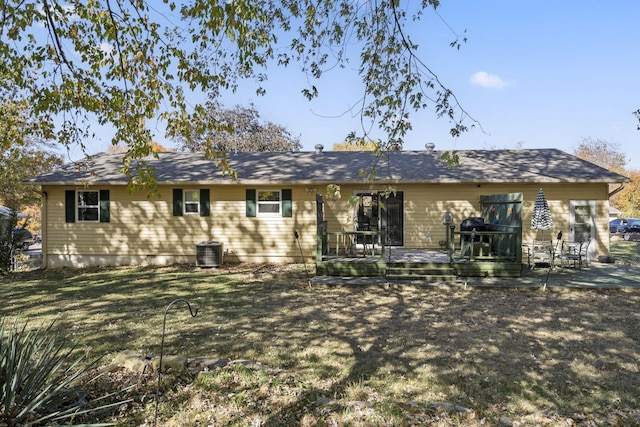 back of property featuring central AC unit