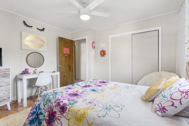 bedroom featuring wood-type flooring, a closet, and ceiling fan