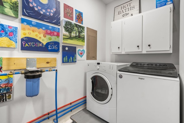 laundry area with cabinets and separate washer and dryer