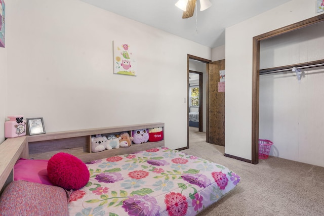 carpeted bedroom with a closet and ceiling fan