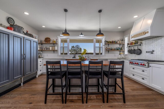 236 N Dade 147, Greenfield, MO 65661 - kitchen with open shelves, stainless steel gas stovetop, light countertops, dark wood-style floors, and white cabinetry