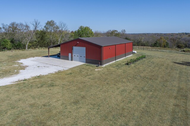 236 N Dade 147, Greenfield, MO 65661 - view of pole building featuring driveway and a yard