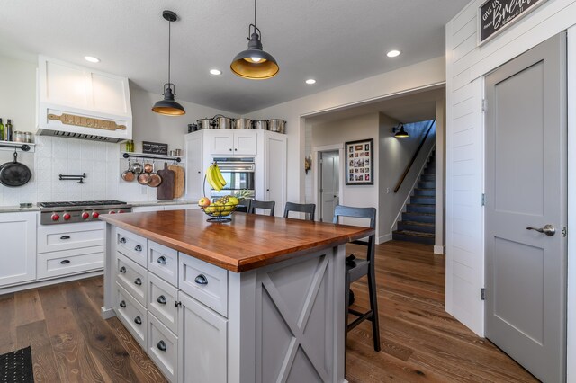 236 N Dade 147, Greenfield, MO 65661 - kitchen featuring wood counters, stainless steel appliances, a breakfast bar, white cabinets, and recessed lighting