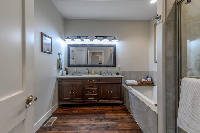 236 N Dade 147, Greenfield, MO 65661 - full bath featuring a bath, double vanity, wood finished floors, and tiled shower