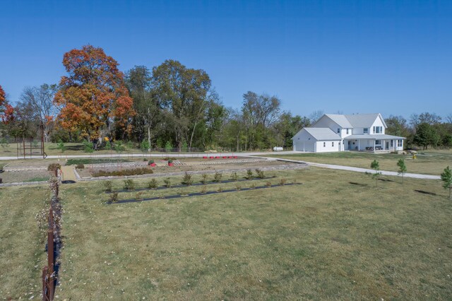 236 N Dade 147, Greenfield, MO 65661 - view of green lawn featuring driveway and an attached garage
