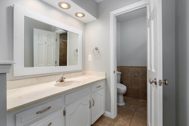 bathroom with tile patterned floors, vanity, and toilet