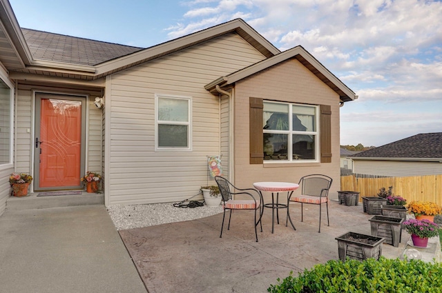 397 Micahs Xing, Reeds Spring, MO 65737 - rear view of property featuring a patio, outdoor dining space, and roof with shingles