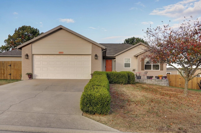 ranch-style house featuring concrete driveway, a garage, fence, and brick siding