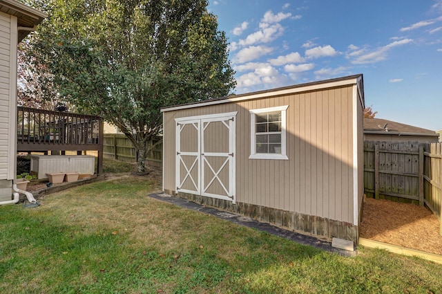 view of outbuilding with a lawn