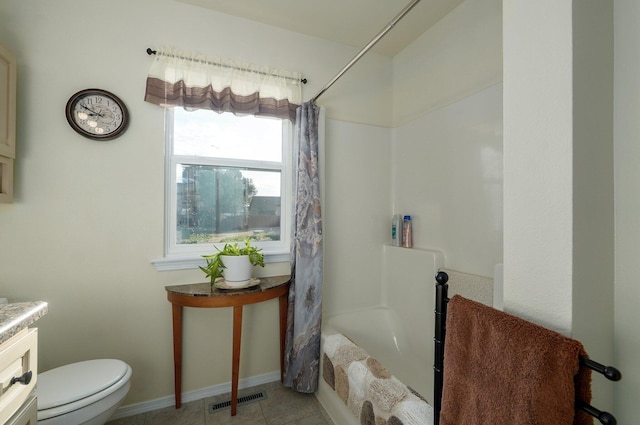 full bathroom with tile patterned flooring, vanity, toilet, and shower / bath combo with shower curtain