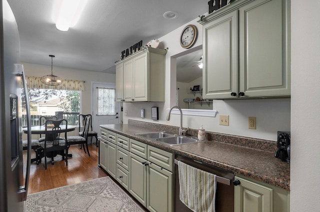 kitchen featuring ceiling fan, sink, stainless steel appliances, dark hardwood / wood-style floors, and decorative light fixtures