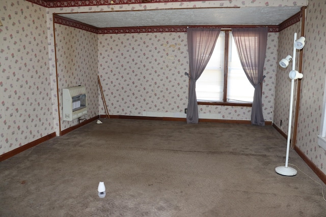 empty room featuring carpet flooring and heating unit