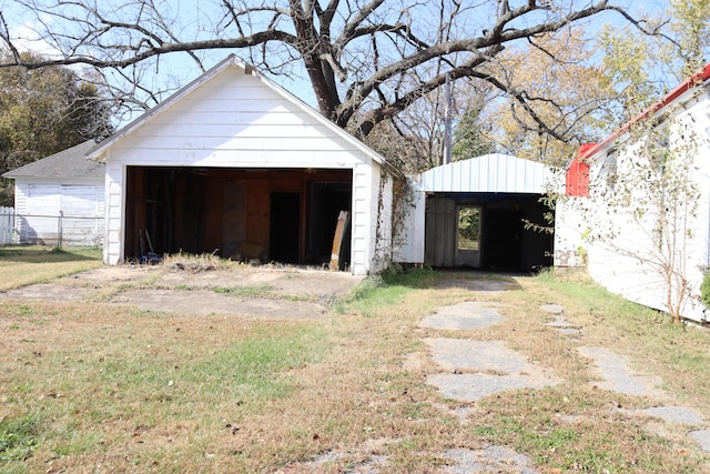 garage featuring a lawn