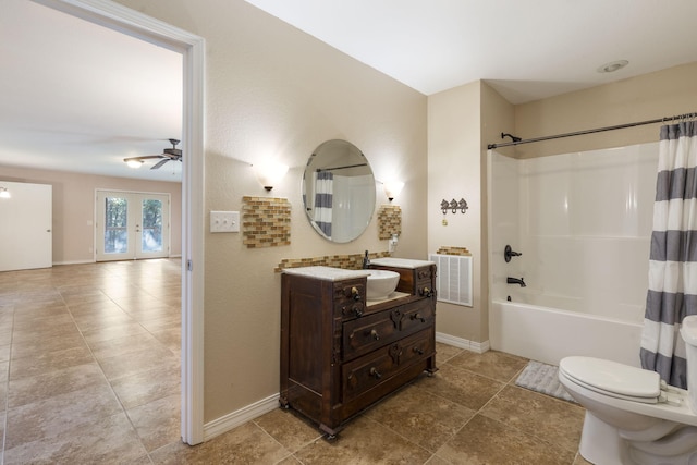 full bathroom with toilet, french doors, shower / bath combo with shower curtain, ceiling fan, and vanity