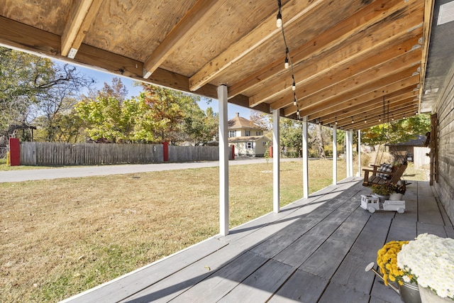 wooden deck featuring a yard