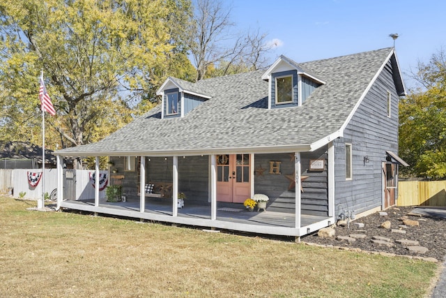 view of front of house featuring a deck and a front lawn